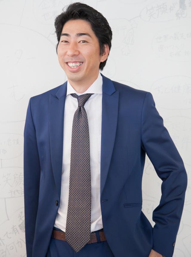 代表取締役の入江恭広氏。紳士服の店長職という異色の経歴の持ち主。