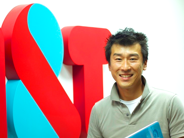 日本のプロジェクト統括を行うプログラムマネージャー河村博文氏。全プロジェクトでスクラムを実践する元制御系エンジニア。